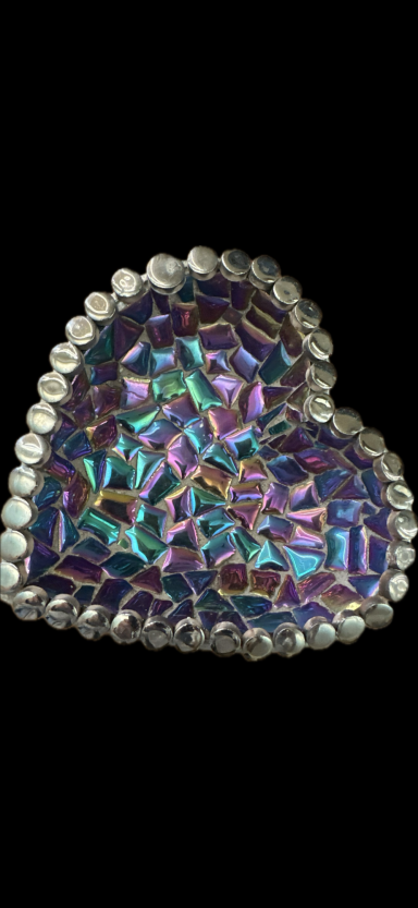Multicolored heart-shaped decoration with a shiny, iridescent surface.